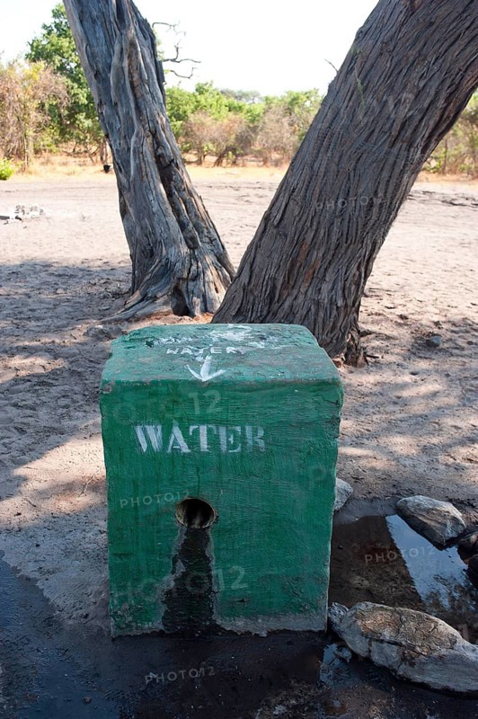 Secured waterhole against baboons, water, drinking water, security, waterhole, tap water, camping, adventure holiday in Savuti camp in the wilderness of Africa in Botswana