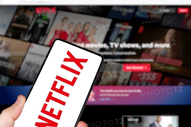 Netflix logo online video streaming platform on a mobile phone and computer in Stuttgart, Germany, Europe