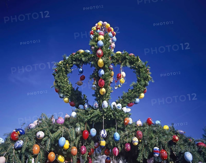 A traditionally decorated Easter tree with colourful Easter eggs under a clear blue sky, Franconian Switzerland, Bavaria, Germany, Europe