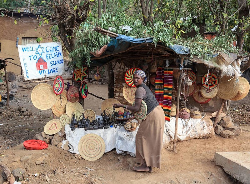 Amhara region, in the Falasha village of Wolleka near Gondar, Gonder, woman selling home-made souvenirs, Ethiopia, Africa