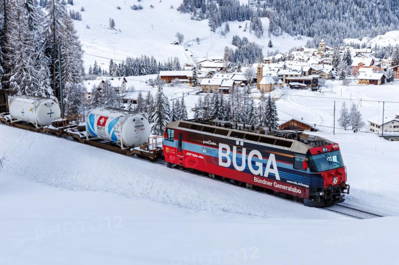 Rhaetian Railway train on the Albula railway Passenger train in the Alps in Bergün, Switzerland, Europe