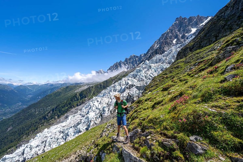 Hiking on the trail to La Jonction, Glacier des Bossons, behind the summit of the Aiguille du Midi, Chamonix, Haute-Savoie, France, Europe