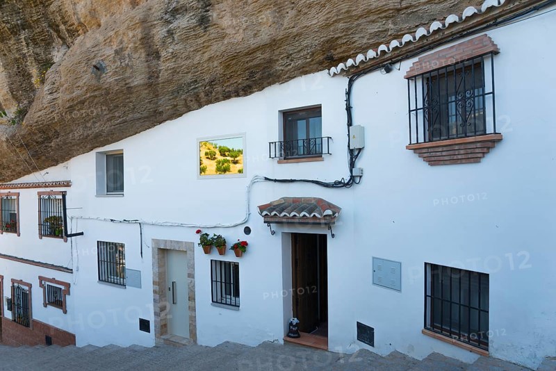 White houses in Setenil de las Bodegas, rocky overhang, sunny sky, cave dwellings, Setenil de las Bodegas, Cadiz, Andalusia, Spain, Europe
