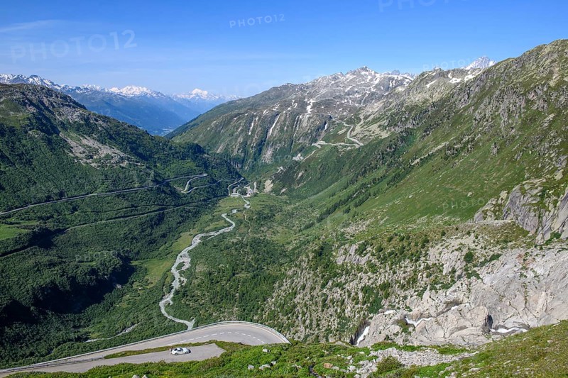 View from Furka road down the valley rhône to front bottom viewpoint to right Rhone waterfall waterfall of Rhone left centre Furka road pass road to Furka pass centre river Rhone right back top steep mountain road to Grimsel pass, Alps, Canton Valais, Switzerland, Europe