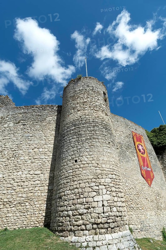 Billy. The fortress castle of the XIII Century, and its coloures banners of the houses of Hogwarts College (Harry Potter), Allier. Auvergne-Rhone-Alpes.France