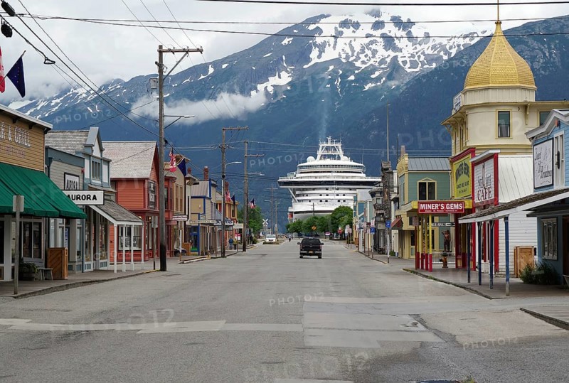 Historic wooden houses and a cruise ship, Skagway, Alaska, USA, North America