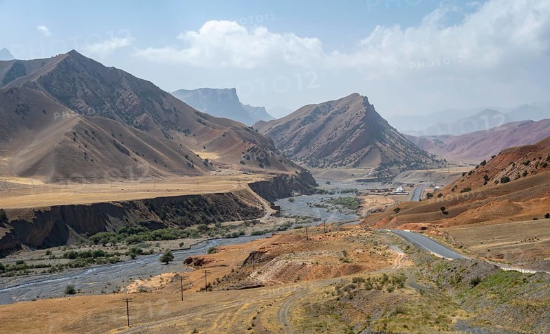 Pamir Highway, mountain road through eroded mountain landscape, Kyrgyzstan, Asia