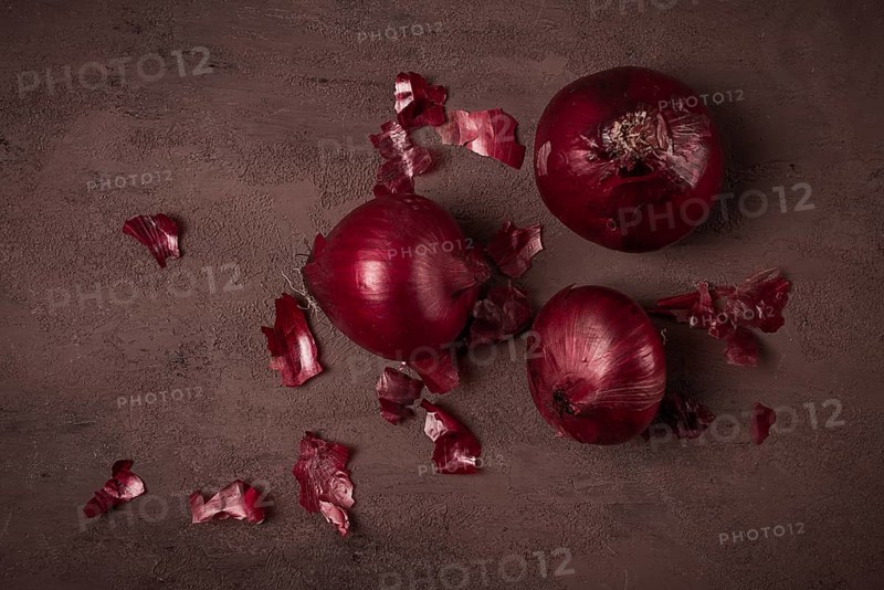 Red onion, fresh, raw, on a dark background, top view