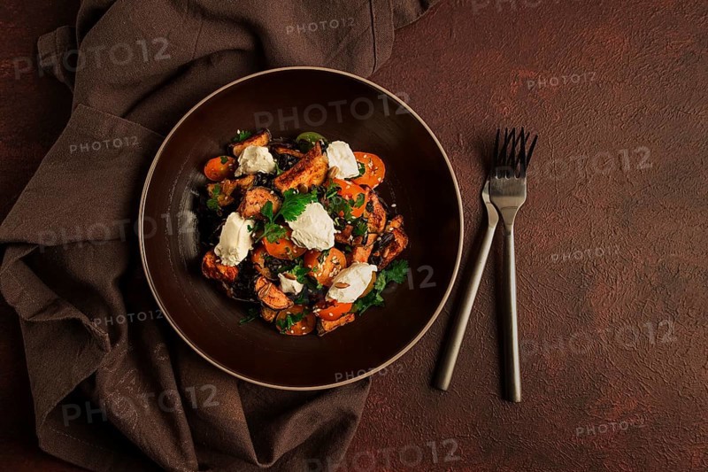 Warm Salad with crispy eggplant and tomatoes, cottage cheese, spices, herbs, sesame seeds, sunflower seeds, Georgian cuisine, no people