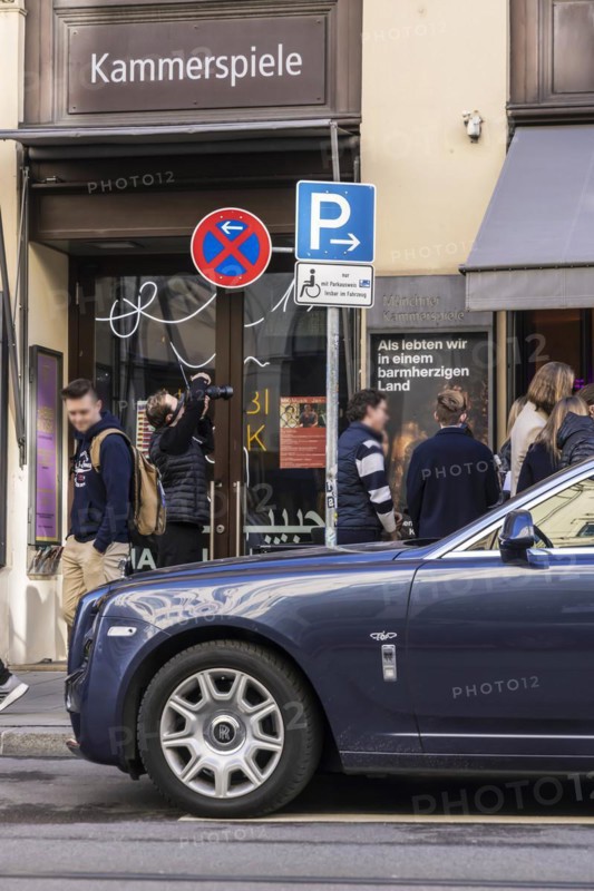 Disabled parking space in front of a trendy bar on the fashionable shopping street Maximilianstraße. Only disabled people with a special permit or drivers of Rolls Royce vehicles are allowed to park here, Munich, Bavaria, Germany, Europe