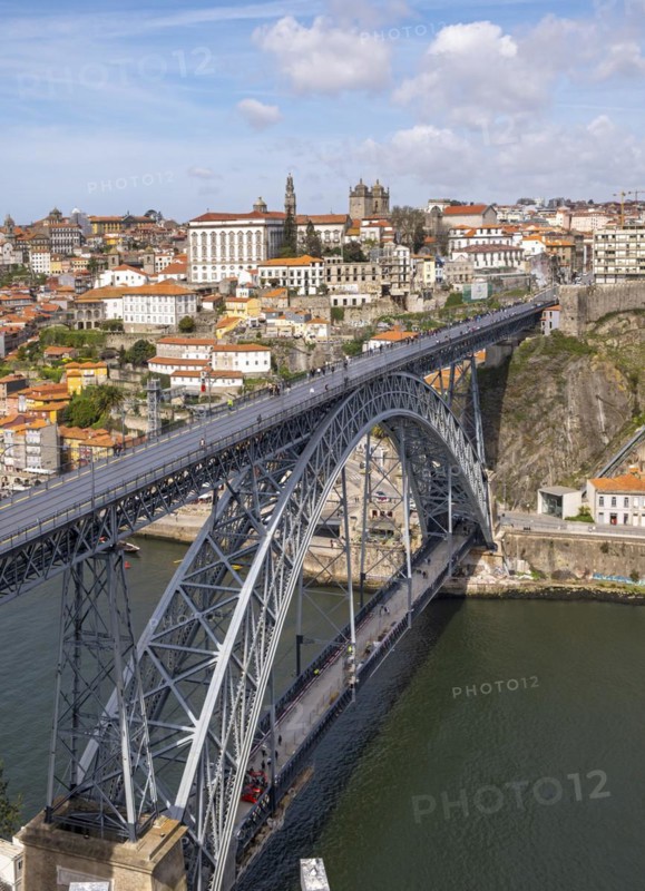 The iconic Dom Luís I Bridge spans the Douro River, with Ribeira district in the background, Porto, Portugal, Europe