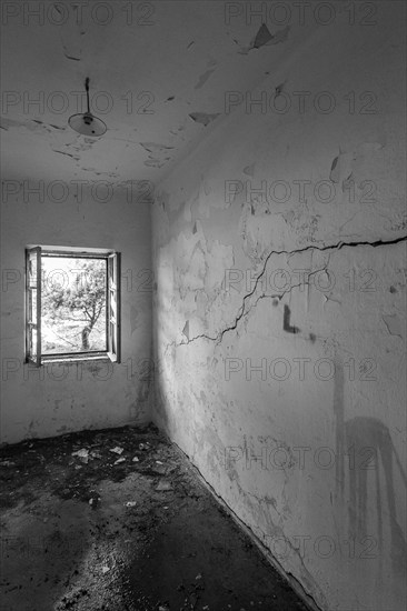 Lost Place, A small abandoned room with cracks and a lonely window, Lastovo, Neretva, Croatia, Europe