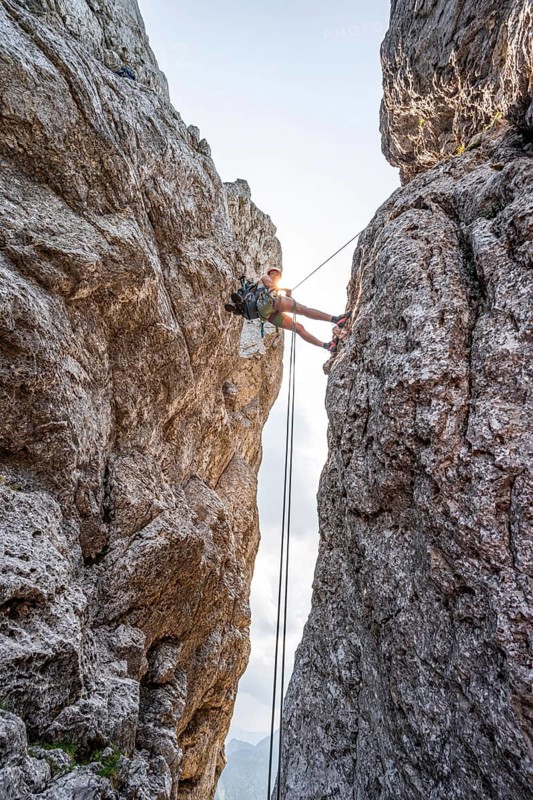 Climber on a climbing tour, abseiling, alpine climbing, crossing the Kampenwand, Chiemgau, Bavaria, Germany, Europe