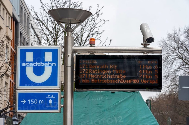 Signage for an underground railway station in Düsseldorf, Königsallee, display board for light rail departures, video surveillance