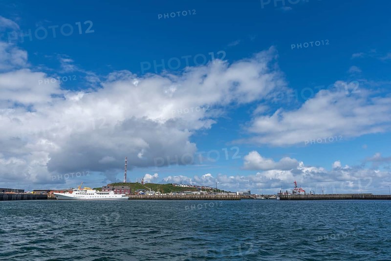 View from south-east to harbour facilities, Unterland and Oberland, offshore island Helgoland, seaside resort ship Funny Girl, blue sky, North Sea, district Pinneberg, Schleswig-Holstein, Germany, Europe