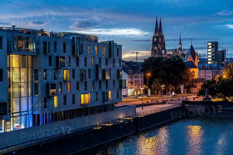 Skyline with Cologne Cathedral, Groß St. Martin Catholic Church, Rheinauenhafen harbour, art'otel cologne on the left, sunset, Rhine, Cologne, North Rhine-Westphalia, Germany, Europe