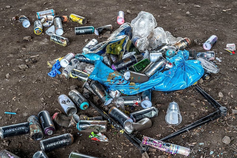 Paint cans, leftover rubbish from graffiti sprayers, under the motorway bridge, the A43 over the Rhine-Herne Canal, Recklinghausen, North Rhine-Westphalia, Germany, Europe