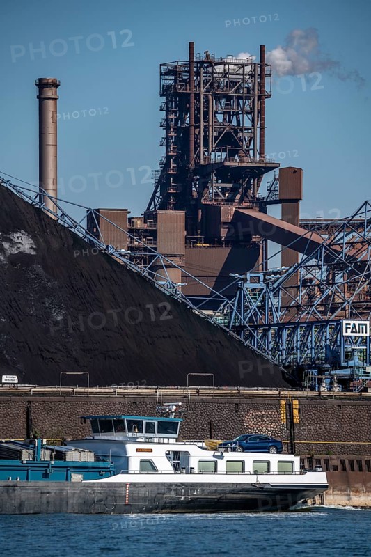 ThyssenKrupp steelworks in Duisburg-Marxloh, blast furnace Schwelgern 2, coal store of the Schwelgern coking plant, cargo ship on the Rhine, Duisburg, North Rhine-Westphalia, Germany, Europe