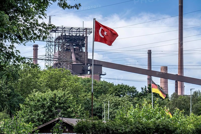 German and Turkish flags flying over the allotment garden association Am Schwelgernpark, Hochhöfen des Thyssenkrupp Steel Stahlwerk Marxloh, Duisburg North Rhine-Westphalia, Germany, Europe