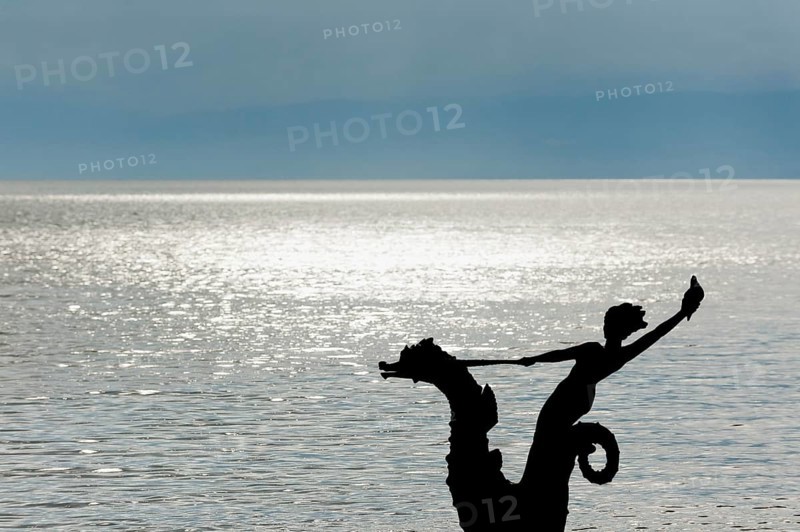 Sculpture with mermaid against the light on the promenade in Vevey on Lake Geneva, Vaud, Switzerland, Europe