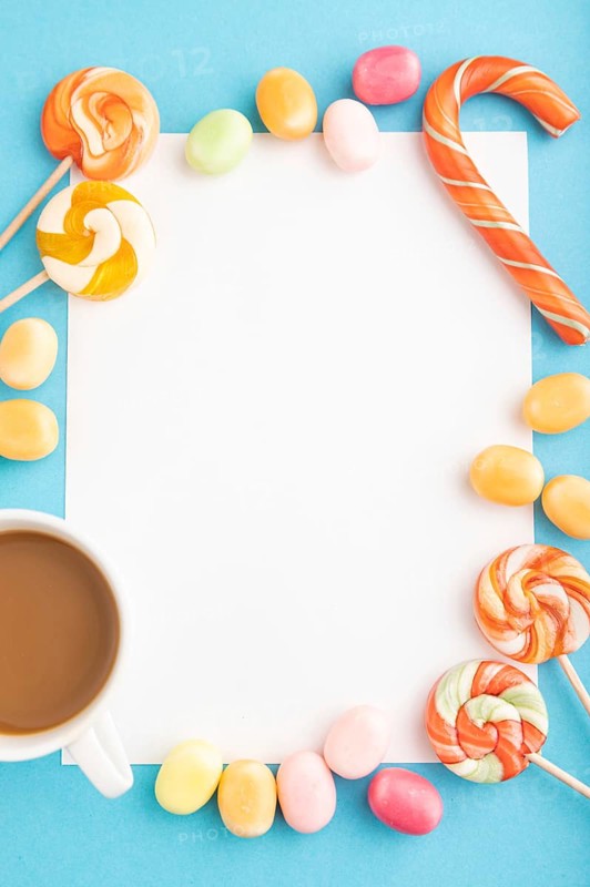 Composition with candies frame on blue pastel background. copy space, top view, flat lay, template