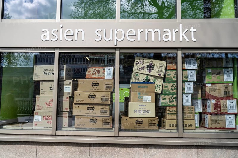 Shop window of an Asian supermarket, for food, full of packaging