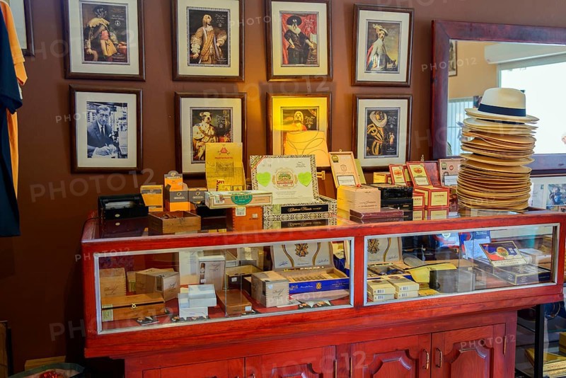 Sale of cigars in a room with portraits and traditional furniture, Bayahibe, Dominican Republic, Hispaniola, Caribbean, America, Central America