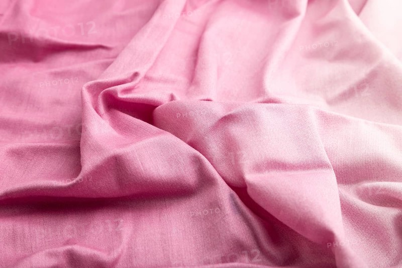 Fragment of cotton purple tissue. Side view, natural textile background and texture. wave concept, abstract
