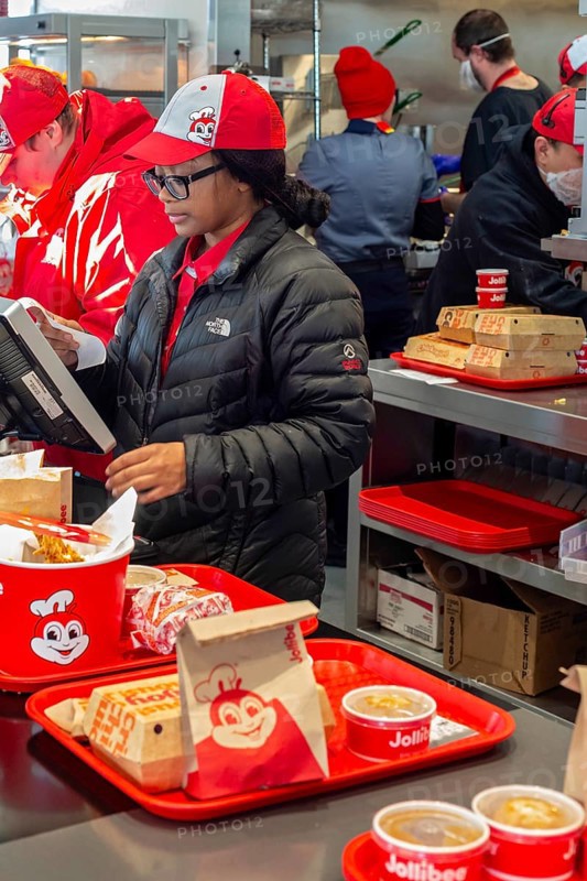 Sterling Heights, Michigan, Workers serve up Chickenjoy fried chicken at Jollibee, a Filipino fast food chain. Jollibee is called the McDonald's of the Philippines. It has 1400 stores worldwide. This one is the first location in Michigan. The chain focuses on locations with many Filipino-Americans