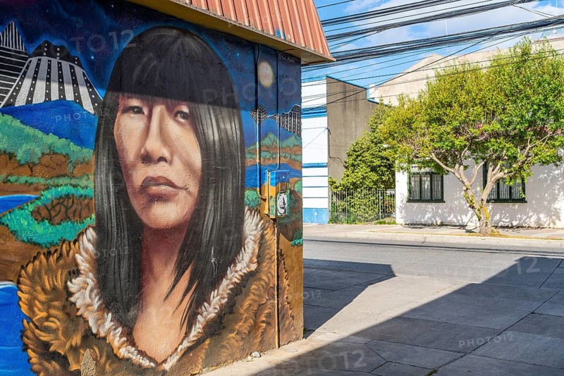 Colourful graffito with the image of an indigenous woman, street art in the city of Punta Arenas, Patagonia, Chile, South America