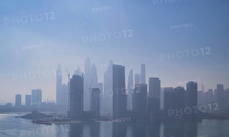 Morning fog, skyline with Princess Tower, Elite Residence, luxury yacht OPERA owned by Sheikh Mansour bin Zayed Al Nahyan from the ruling family of the Emirate of Dubai anchors in front of EMAAR Beachfront, Logo, Dubai Marina, Dubai, United Arab Emirates, VAR, Asia