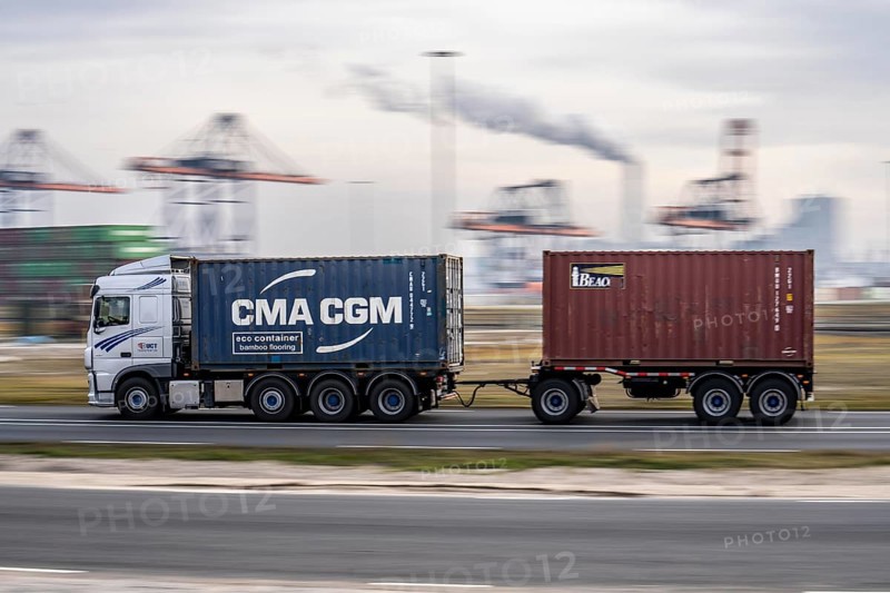 Container lorry, bringing containers to Euromax Container Terminal, the seaport of Rotterdam, Netherlands, deep-sea port Maasvlakte 2, on a man-made land area off the original coastline