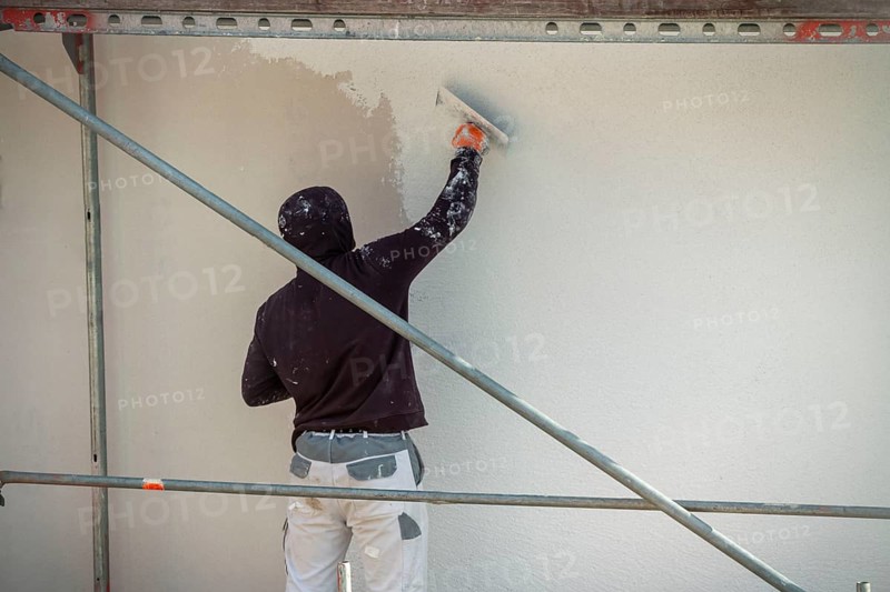 Building site, thermal insulation, external insulation, facade insulation, insulated facade of a new building being plastered, Duisburg, North Rhine-Westphalia, Germany, Europe