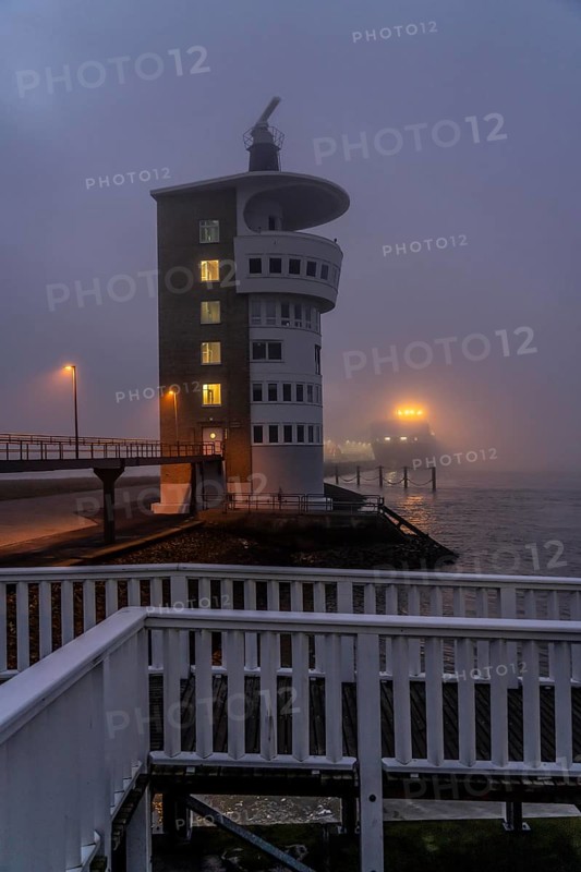 Thick fog in winter, hanging over the mouth of the Elbe into the North Sea, radar tower of the Cuxhaven Waterways and Shipping Office (WSA), radar monitoring of the shipping lanes, shipping traffic in the Elbe estuary, at the Alte Liebe viewpoint, in Cuxhaven, Lower Saxony, Germany, Europe