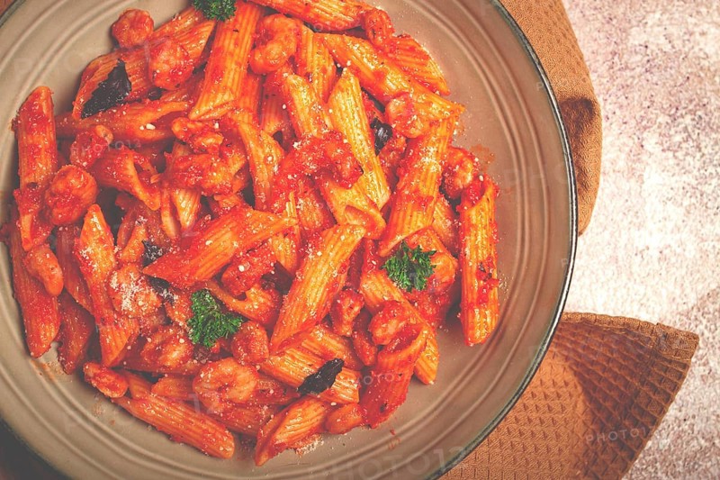 Penne pasta, with shrimp in tomato sauce, close-up, no people