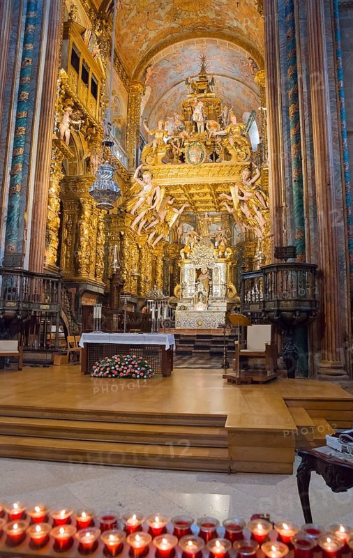 Baroque church interior with golden decorations, altar and burning candles in the foreground, cathedral, Santiago de Compostela, autonomous community of Galicia, place of pilgrimage, destination of the Way of St James, Spain, Europe