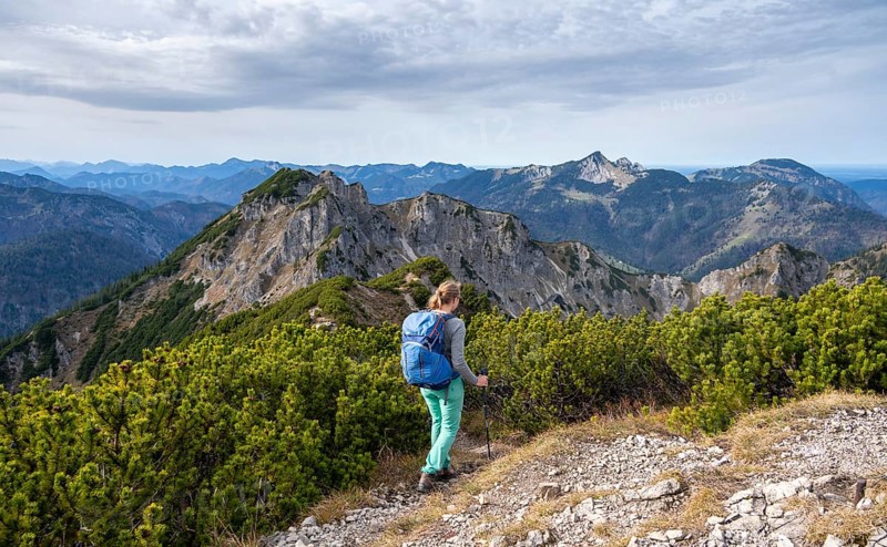 View over the mountain ridge of the Schindergebirge to the Bavarian Schinder, mountaineer on hiking trail to the Austrian Schinder, Bavarian Prealps, Mangfall mountains, Bavaria, Germany, Europe