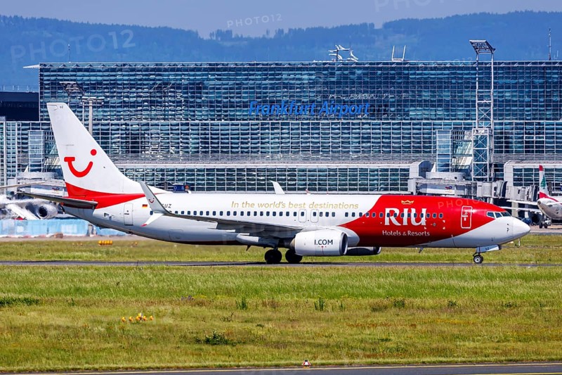 A Boeing 737-800 aircraft of TUI with the registration D-ATUZ and the RIU Hotels & Resorts special livery at the airport in Frankfurt, Germany, Europe