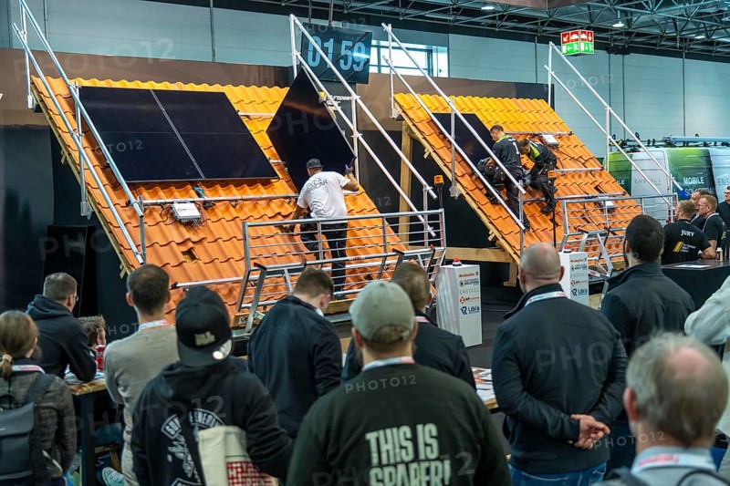 Presentation of the rapid installation of a solar system on a residential house with a pitched roof, in the form of a competition, European Solar Games, at the Solar Solutions Düsseldorf trade fair, over 250 international exhibitors present products and services from the solar industry, smart storage, EV charging and green HVAC to a trade audience of users and dealers, Düsseldorf, North Rhine-Westphalia, Germany, Europe