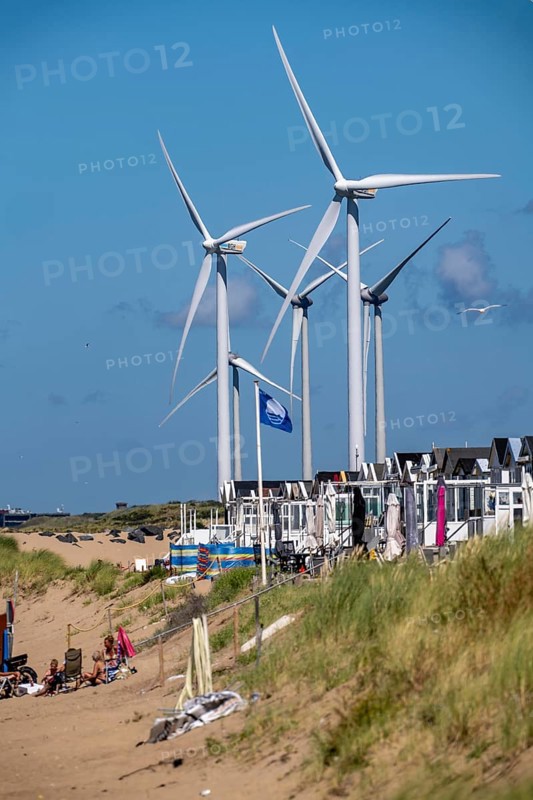 Wind turbines, wind farm, holiday homes, beach houses on the beach of Ijmuiden in North Holland, Netherlands