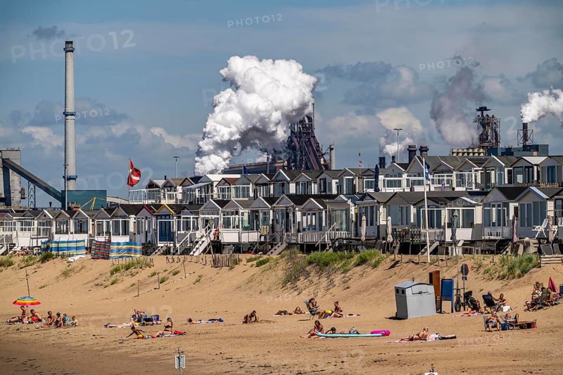The Tata Steel steel and smelting works in IJmuiden, Velsen, North Holland, Netherlands, largest industrial area in the Netherlands, 2 blast furnaces, 2 coking plants, rolling mills, directly on the North Sea, beach houses near Ijmuiden aan Zee