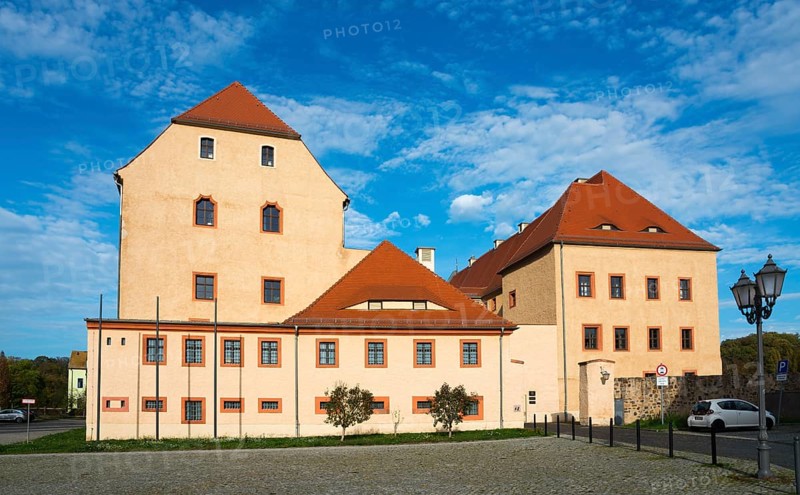Medieval castle with tiled roof and many windows under a blue sky on a sunny day, castle, today district court, Grimma, Leipzig, Saxony, Germany, Europe