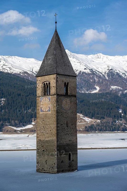 Church tower in Lake Reschen in winter, Reschen Pass, South Tyrol, Italy, Europe