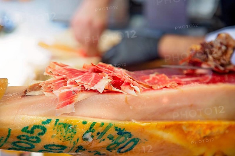 Famous street market near Barcelona Cathedral in Las Ramblas, Jamon Serrano preparation stand