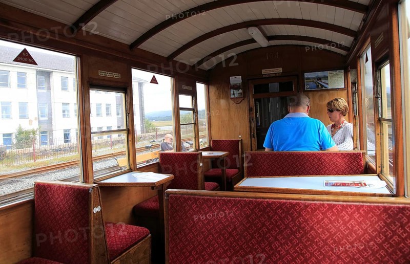 Passengers inside train carriage of Ffestiniog railway, Gwynedd, north west Wales, UK