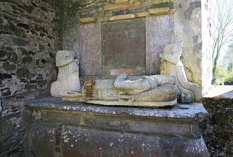 Weathered damaged memorials inside seventeenth century Kilcredan church ruins and graveyard, County Cork, Ireland, Europe