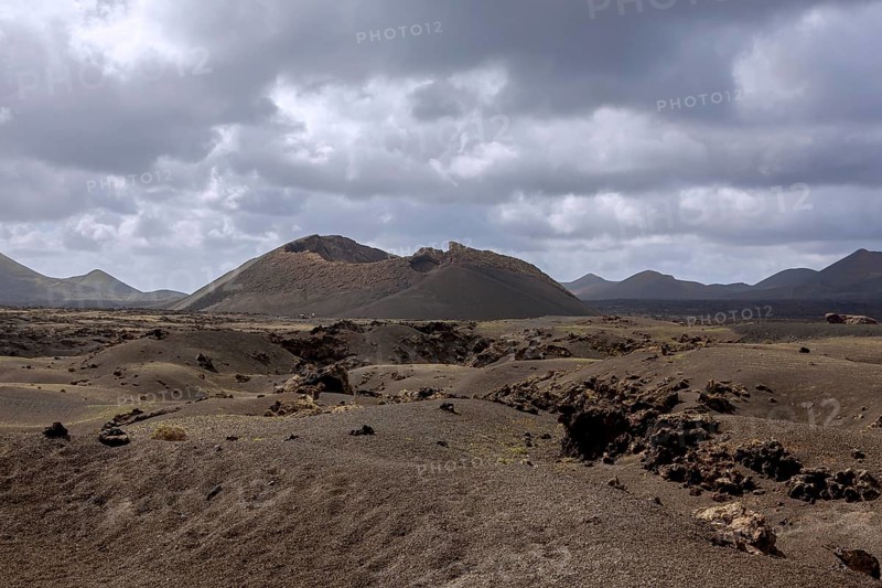Volcanic landscape with view of the Caldera de Los Cuervos, Timanfaya National Park, Lanzarote, Canary Islands, Spain, Europe
