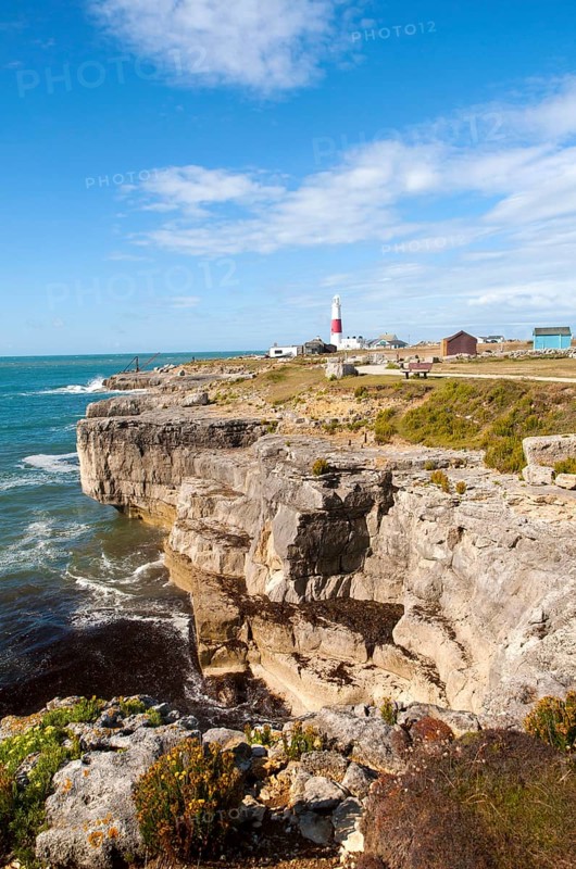 Red and white lighthouse on the coast at Portland Bill, Isle of Portland, Dorset, England, United Kingdom, Europe