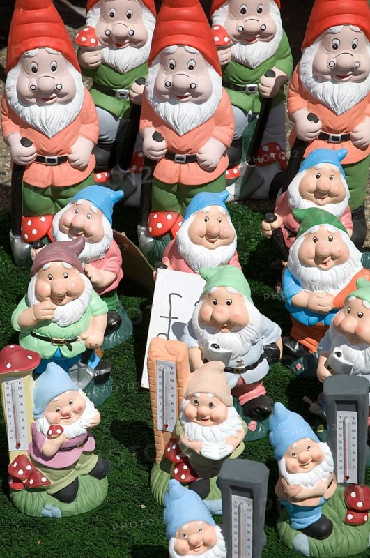 Colourful garden gnomes lined up for sale, UK