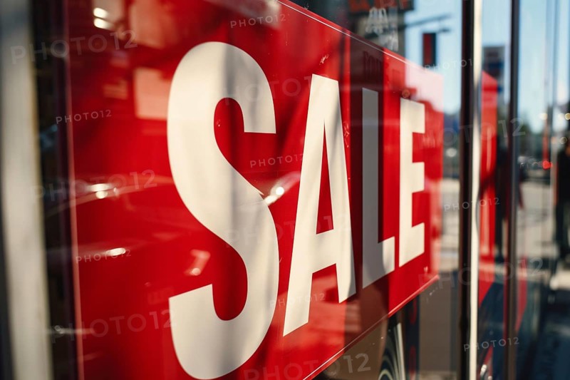 Red advertisement sign with text 'Sale' in shopping window. Generative AI, AI generated